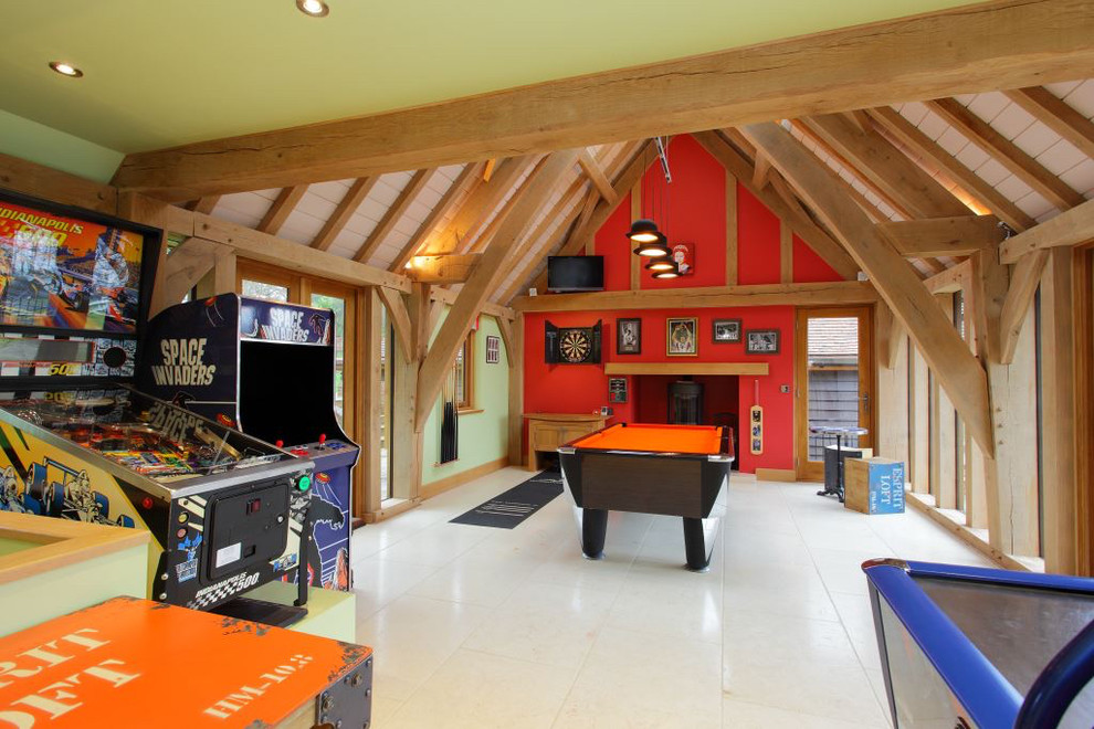 This is an example of a mid-sized country enclosed family room in Hampshire with a game room, red walls and white floor.