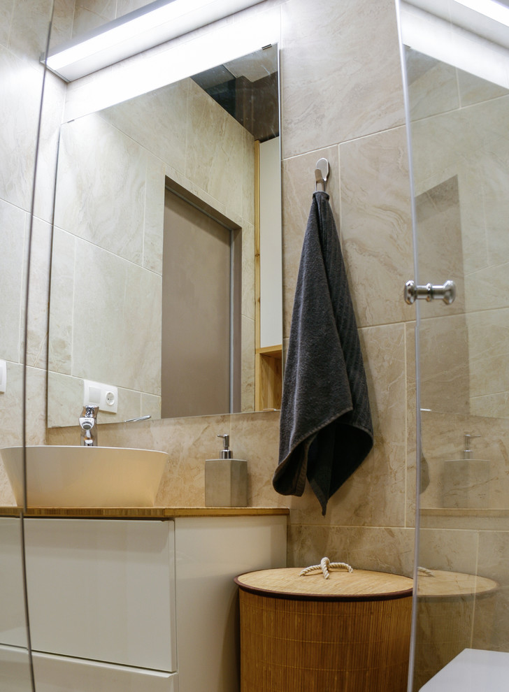 This is an example of a small scandinavian 3/4 bathroom in Moscow with flat-panel cabinets, white cabinets, an alcove shower, a wall-mount toilet, beige tile, porcelain tile, brown walls, porcelain floors, a vessel sink, wood benchtops, beige floor and a hinged shower door.