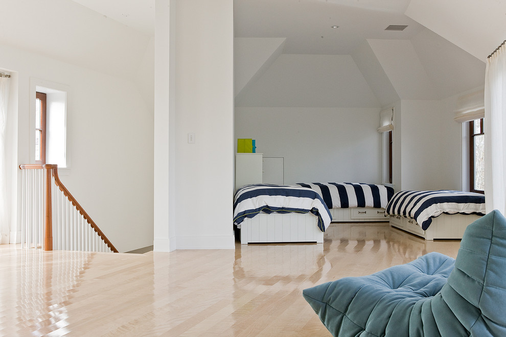 Contemporary loft-style bedroom in Boston with white walls and light hardwood floors.