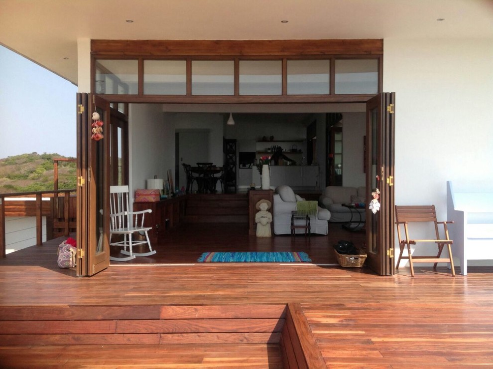 Example of a large eclectic rooftop deck design with no cover