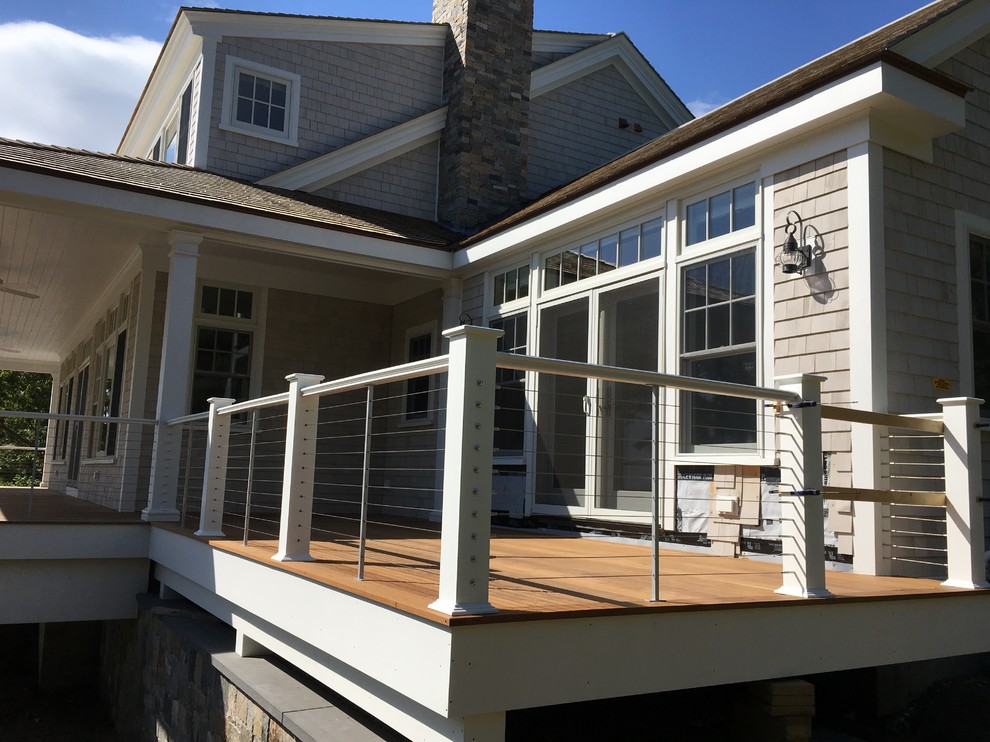 Example of a transitional home design design in Boston