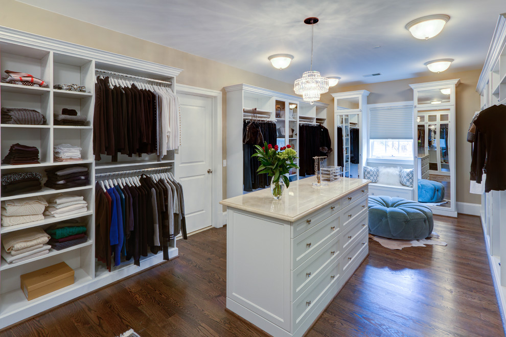 Transitional women's medium tone wood floor dressing room photo in DC Metro with white cabinets and recessed-panel cabinets