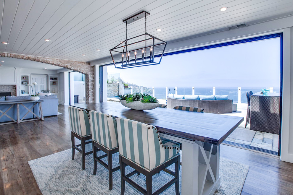 Expansive beach style galley open plan kitchen in Los Angeles with shaker cabinets, grey cabinets, marble benchtops, medium hardwood floors, multiple islands, multi-coloured floor and multi-coloured benchtop.