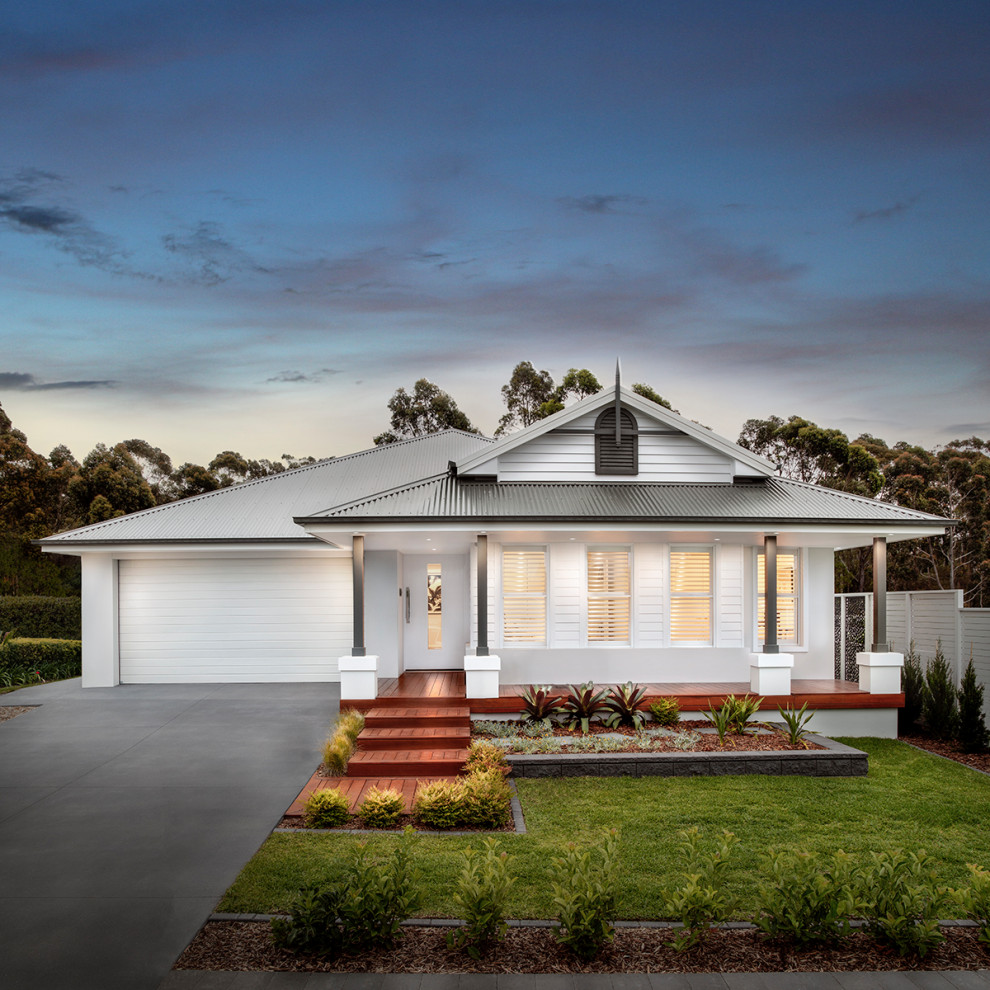 Inspiration for a mid-sized traditional one-storey white house exterior in Sydney with concrete fiberboard siding, a gable roof and a metal roof.
