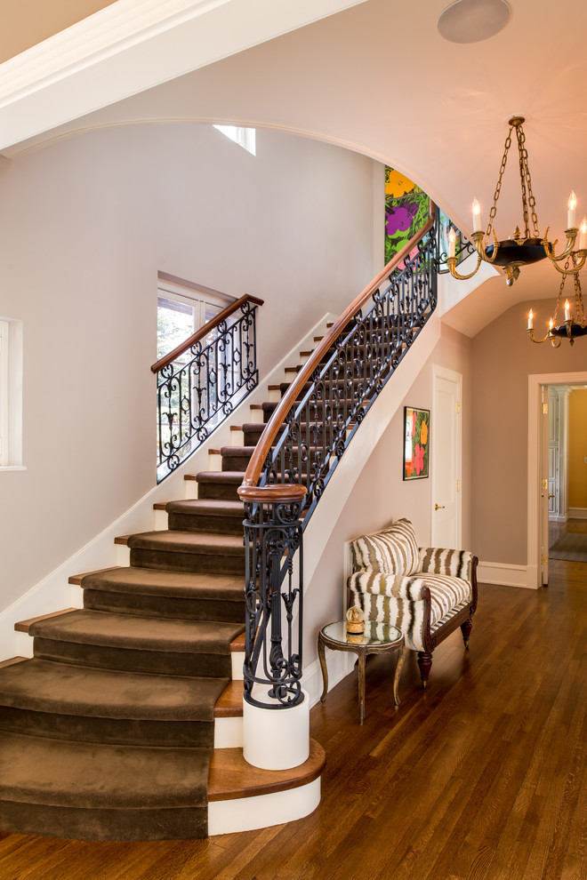 Inspiration for a large traditional wood straight staircase in Philadelphia with painted wood risers.