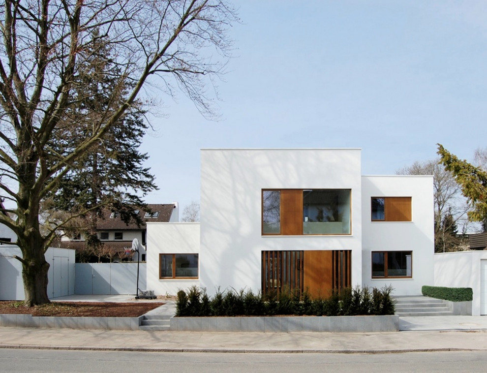 Inspiration for a large contemporary two-storey white exterior in Hanover with a flat roof.