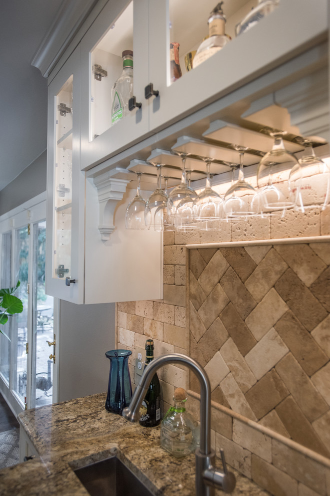 Eat-in kitchen - large transitional u-shaped medium tone wood floor and brown floor eat-in kitchen idea with an undermount sink, shaker cabinets, white cabinets, granite countertops, beige backsplash, paneled appliances and an island