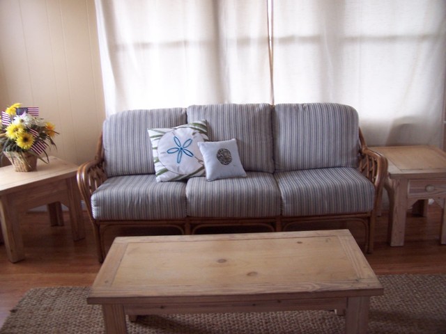 New Rattan Sofa And Throw Pillows In Beach Cottage Living Room