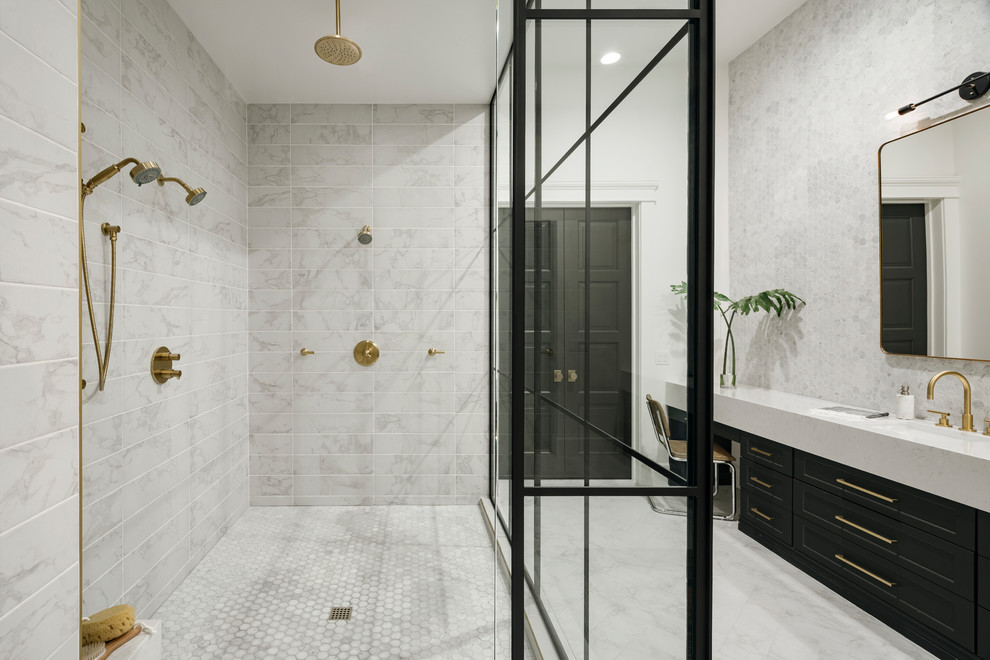 Example of a large transitional master gray tile and marble tile ceramic tile and gray floor freestanding bathtub design in Phoenix with shaker cabinets, black cabinets, a one-piece toilet, white walls, an undermount sink and quartz countertops