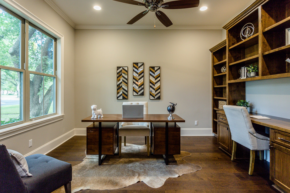 Photo of a large contemporary study room in Houston with grey walls, dark hardwood floors, a built-in desk and brown floor.
