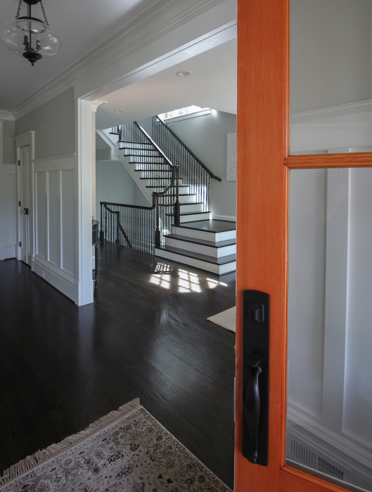 Inspiration for a large transitional wooden l-shaped mixed material railing staircase remodel in DC Metro with painted risers