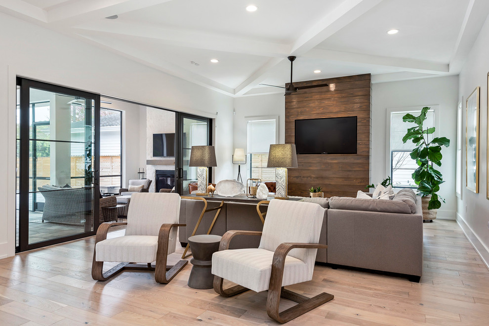 Large open concept family room in Orlando with a built-in media wall.