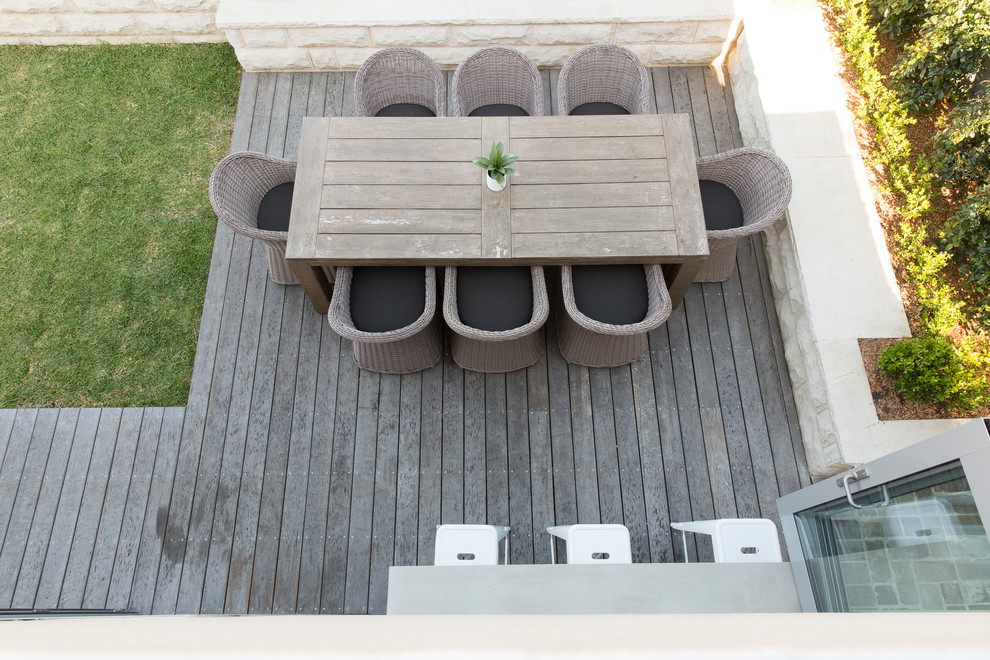 Inspiration for a mid-sized contemporary backyard deck in Sydney with a container garden and no cover.