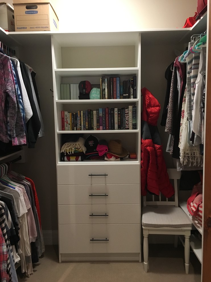 Example of a mid-sized transitional gender-neutral carpeted and gray floor walk-in closet design in Denver with flat-panel cabinets and white cabinets