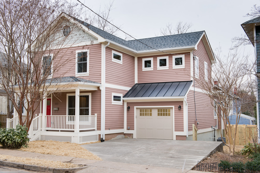 This is an example of a mid-sized traditional three-storey pink exterior in DC Metro with mixed siding.