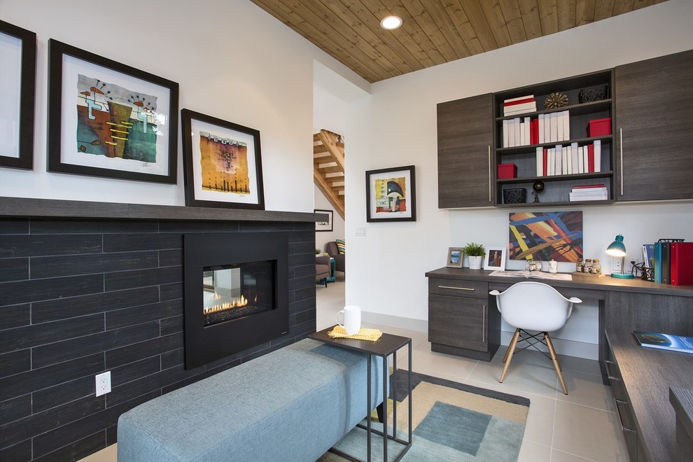 Design ideas for a contemporary home office in Seattle with white walls, a ribbon fireplace and grey floor.