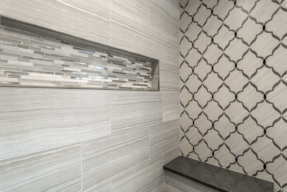 Mid-sized transitional master gray tile and porcelain tile ceramic tile and beige floor home design photo with recessed-panel cabinets, dark wood cabinets, a one-piece toilet, gray walls and quartz countertops