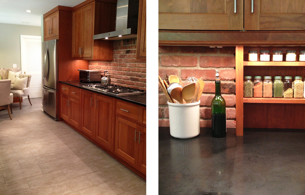 Inspiration for a mid-sized transitional galley cement tile floor and gray floor eat-in kitchen remodel in New York with an undermount sink, shaker cabinets, medium tone wood cabinets, granite countertops, red backsplash, brick backsplash, stainless steel appliances and no island