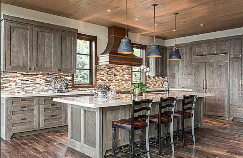 Inspiration for a large transitional l-shaped dark wood floor and brown floor open concept kitchen remodel in Vancouver with an undermount sink, shaker cabinets, gray cabinets, multicolored backsplash, matchstick tile backsplash, an island and paneled appliances