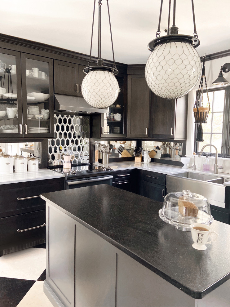 Transitional kitchen in Providence with a farmhouse sink, shaker cabinets, black cabinets, marble benchtops, metallic splashback, mirror splashback, stainless steel appliances, cork floors, with island, black floor and multi-coloured benchtop.