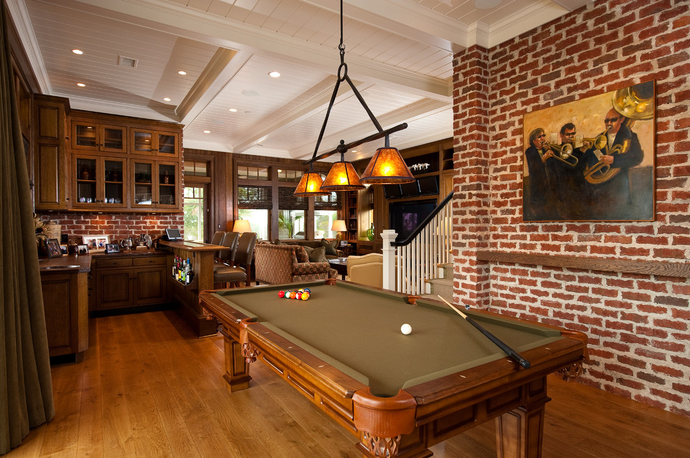 Country family room in Charleston with medium hardwood floors.
