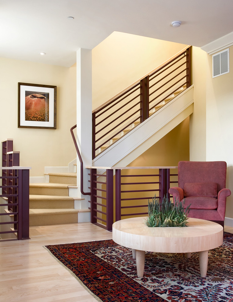 Inspiration for a transitional wood l-shaped staircase in Denver with painted wood risers.