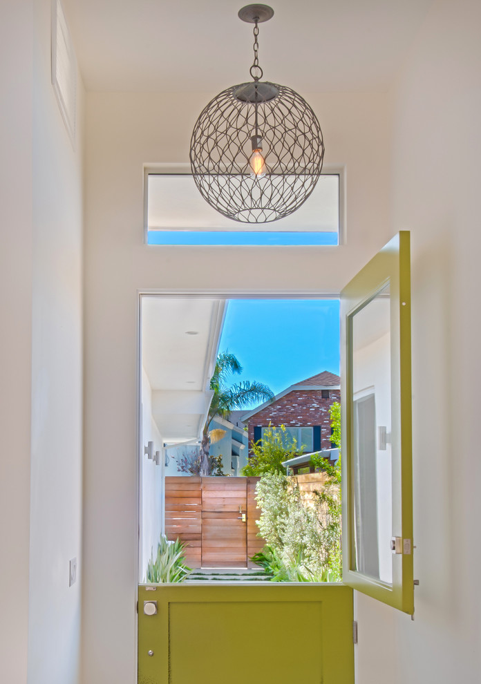 Photo of a beach style entryway in Orange County with a dutch front door.