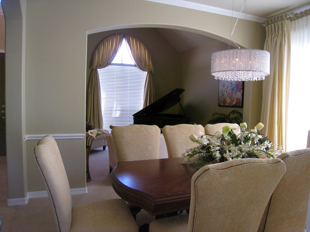 This is an example of a mid-sized traditional separate dining room in Austin with beige walls, carpet and beige floor.