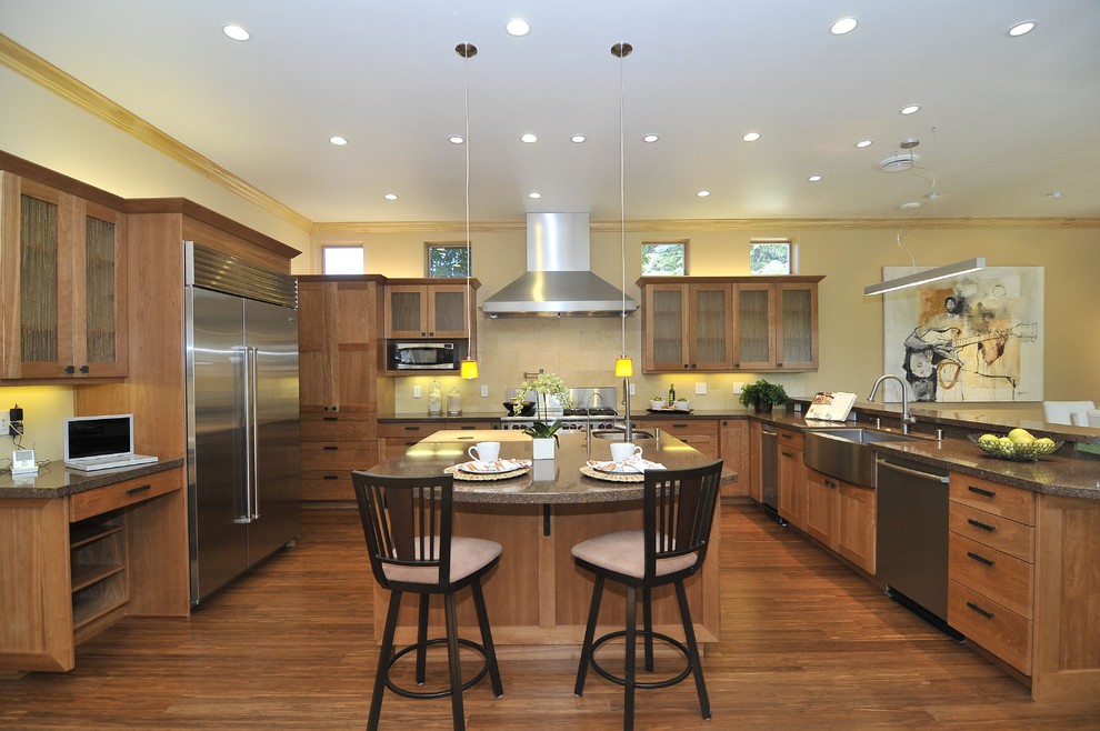 Large transitional u-shaped open concept kitchen photo in San Francisco with a farmhouse sink, shaker cabinets, medium tone wood cabinets, quartz countertops, beige backsplash, stone tile backsplash and stainless steel appliances