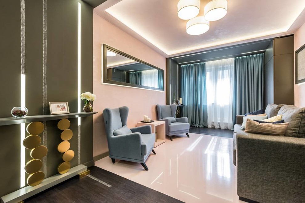 Photo of a contemporary enclosed living room in Moscow with pink walls, concrete floors and pink floor.