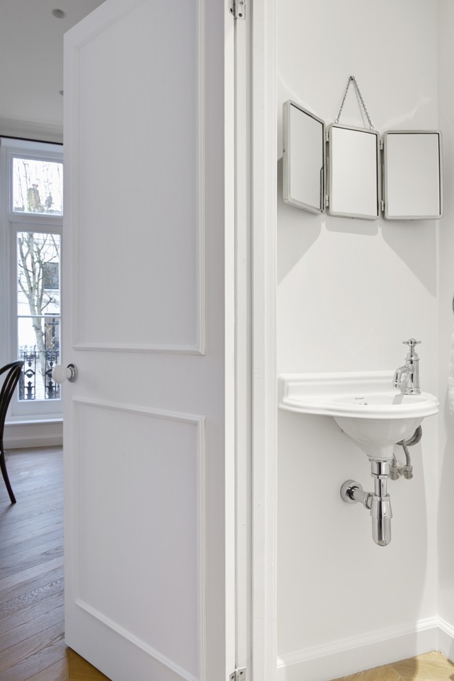 Design ideas for a small traditional master bathroom in London with glass-front cabinets, white cabinets, a one-piece toilet, white tile, white walls, cement tiles, a console sink, multi-coloured floor and white benchtops.