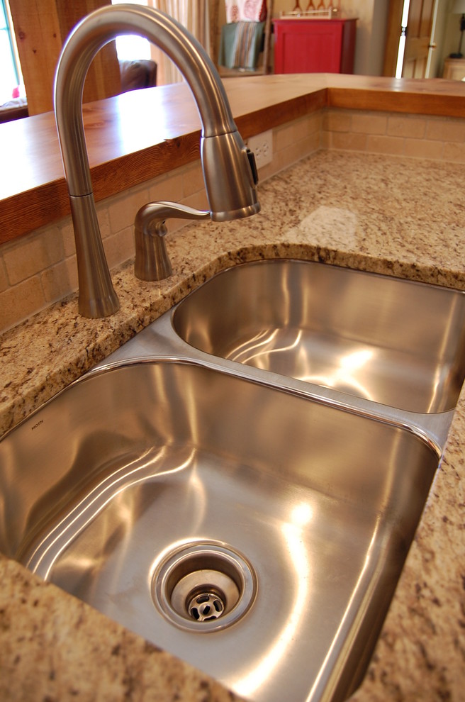 Example of a mountain style kitchen design in Denver