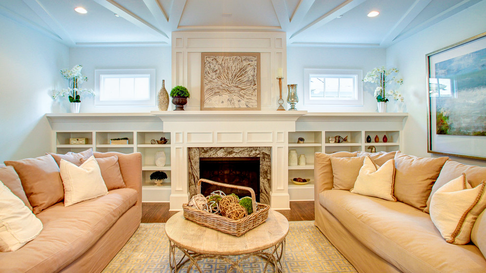 Inspiration for a mid-sized transitional formal enclosed living room with white walls, medium hardwood floors, no tv, beige floor, a standard fireplace and a stone fireplace surround.