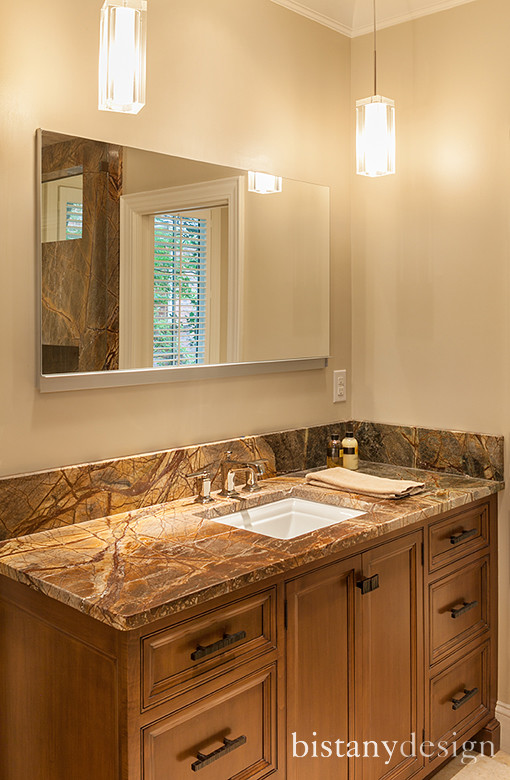 This is an example of a mid-sized transitional master bathroom in Charlotte with an undermount sink, recessed-panel cabinets, medium wood cabinets, marble benchtops, beige tile and beige walls.