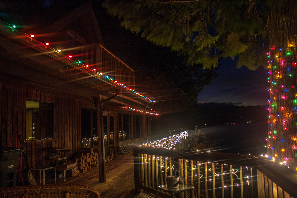 Mid-sized backyard deck photo in Seattle
