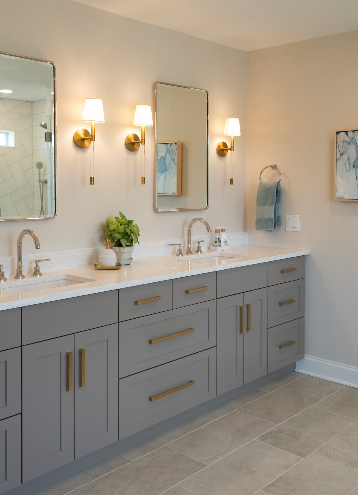 Large transitional master bathroom in New York with flat-panel cabinets, grey cabinets, a freestanding tub, a bidet, white tile, marble, white walls, an undermount sink, engineered quartz benchtops, beige floor, a hinged shower door, white benchtops, an enclosed toilet, a double vanity and a built-in vanity.