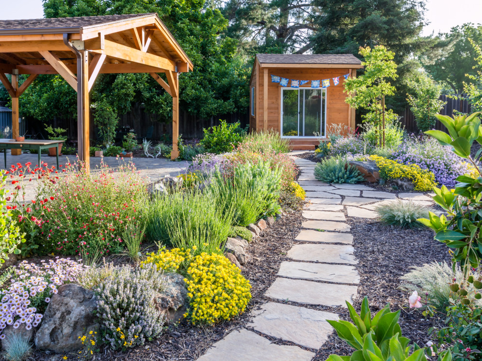 This is an example of a mediterranean drought-tolerant and full sun backyard stone vegetable garden landscape in San Francisco.