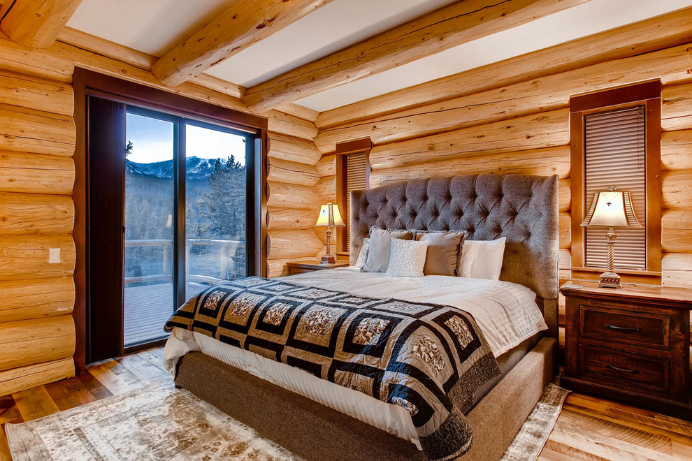 Bedroom - mid-sized rustic master medium tone wood floor bedroom idea in Denver