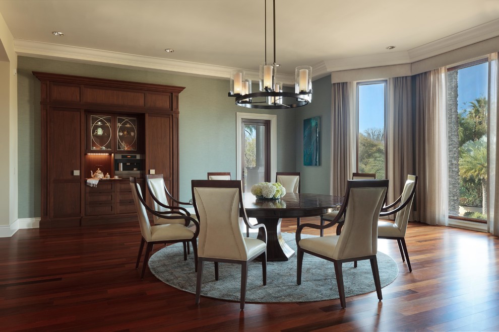 Design ideas for a large transitional separate dining room in Tampa with black walls, dark hardwood floors, no fireplace and brown floor.