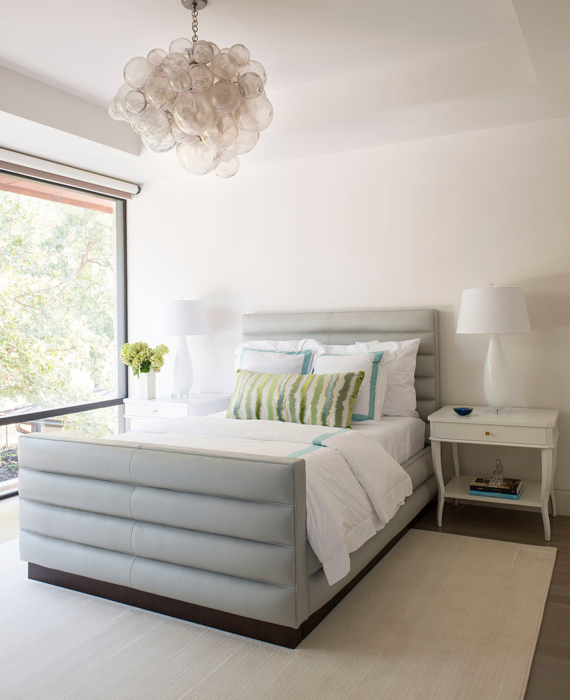 Design ideas for a contemporary bedroom in Dallas with white walls and dark hardwood floors.