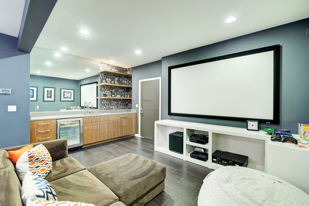 Photo of a large contemporary open concept home theatre in Seattle with blue walls, dark hardwood floors, a projector screen and brown floor.