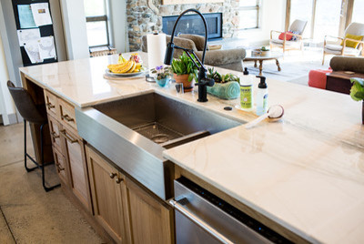 Eat-in kitchen - large rustic concrete floor and gray floor eat-in kitchen idea with an undermount sink, shaker cabinets, light wood cabinets, granite countertops, stainless steel appliances and an island