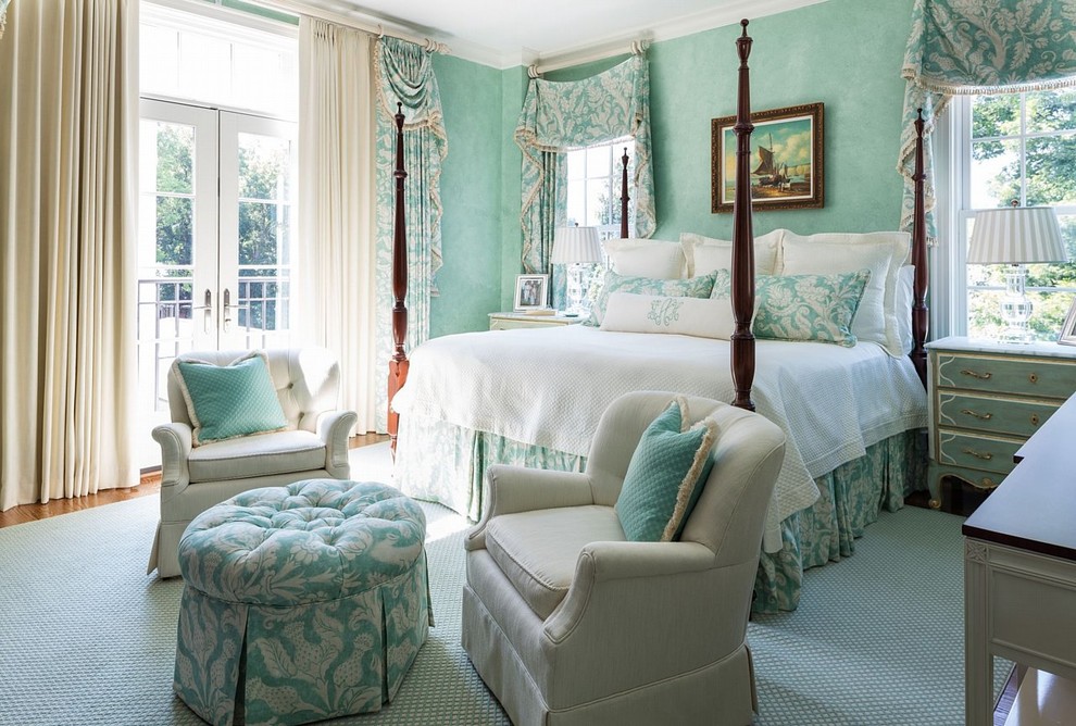 Design ideas for a large traditional master bedroom in Raleigh with blue walls and medium hardwood floors.
