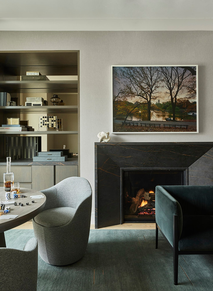 Mid-sized contemporary formal enclosed living room in San Francisco with grey walls, medium hardwood floors, a standard fireplace, a metal fireplace surround and no tv.