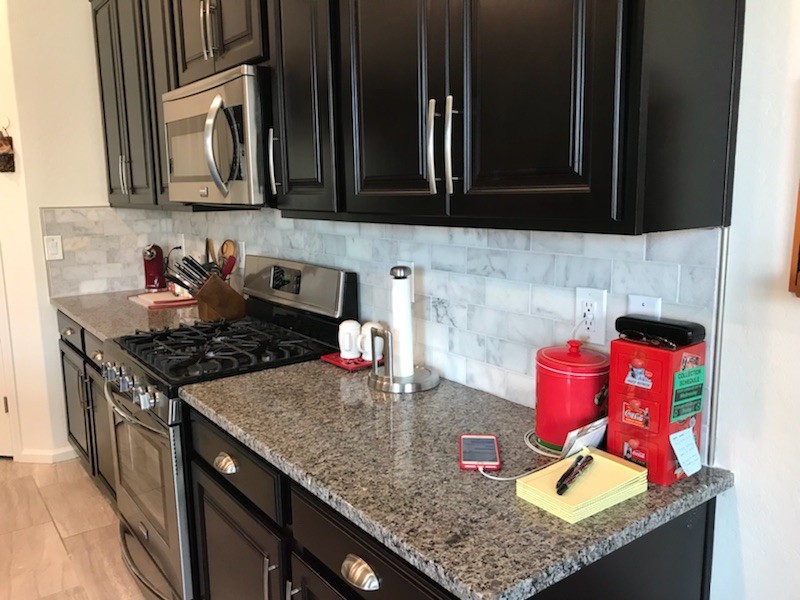Inspiration for a mid-sized modern single-wall eat-in kitchen remodel in Phoenix with brown backsplash, brick backsplash, an island and white countertops