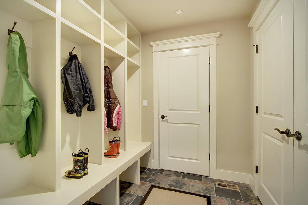 Design ideas for an arts and crafts mudroom in Seattle with beige walls, slate floors, a double front door and a white front door.