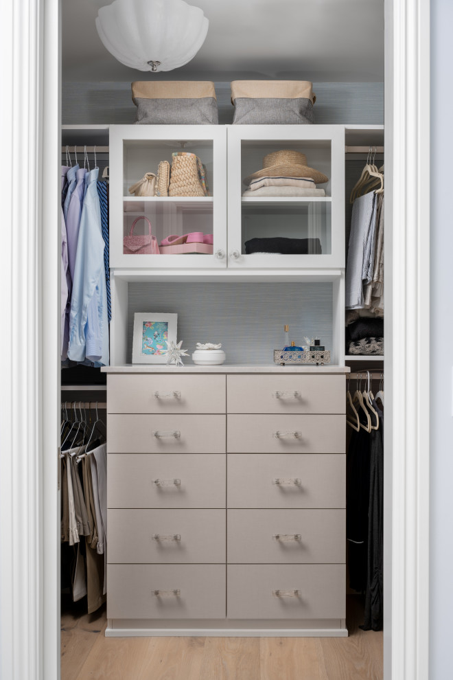 This is an example of a large beach style storage and wardrobe in Orange County with shaker cabinets, blue cabinets, white floor and vaulted.