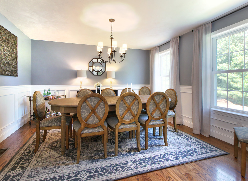 Inspiration for a mid-sized transitional separate dining room in Portland Maine with grey walls, medium hardwood floors, no fireplace and brown floor.