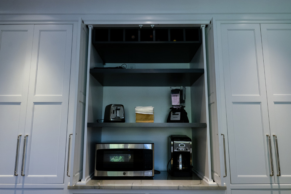 Eat-in kitchen - large transitional u-shaped eat-in kitchen idea in DC Metro with recessed-panel cabinets, white cabinets, marble countertops and an island