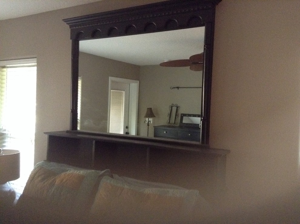 Large mirror over bed.
